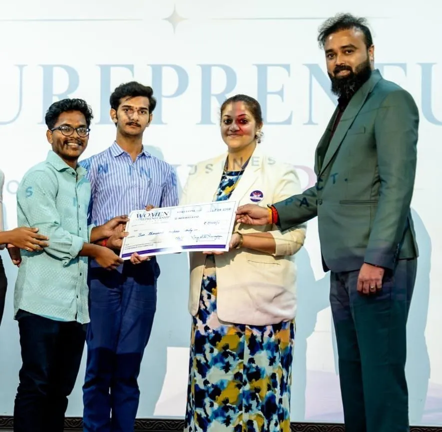 Student founders receiving a Women Entrepreneurship Conclave cheque from the organisers.